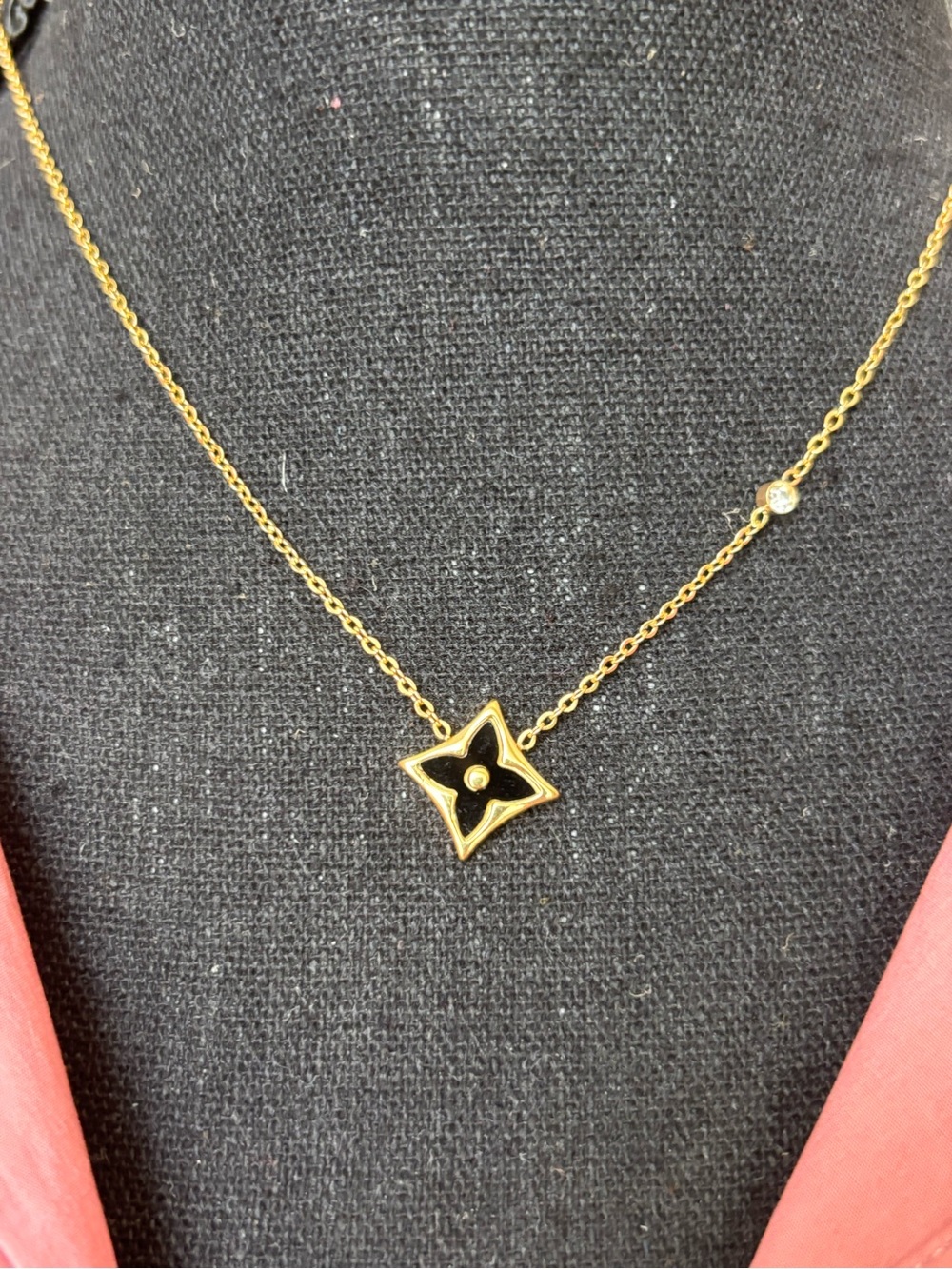 Gold Star Pendant Necklace with Black Enamel Accent